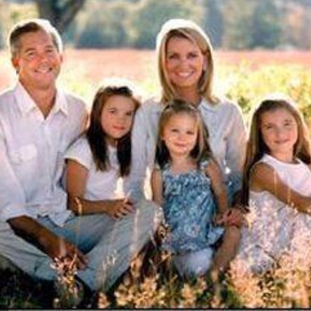 David and his family posing for a picture